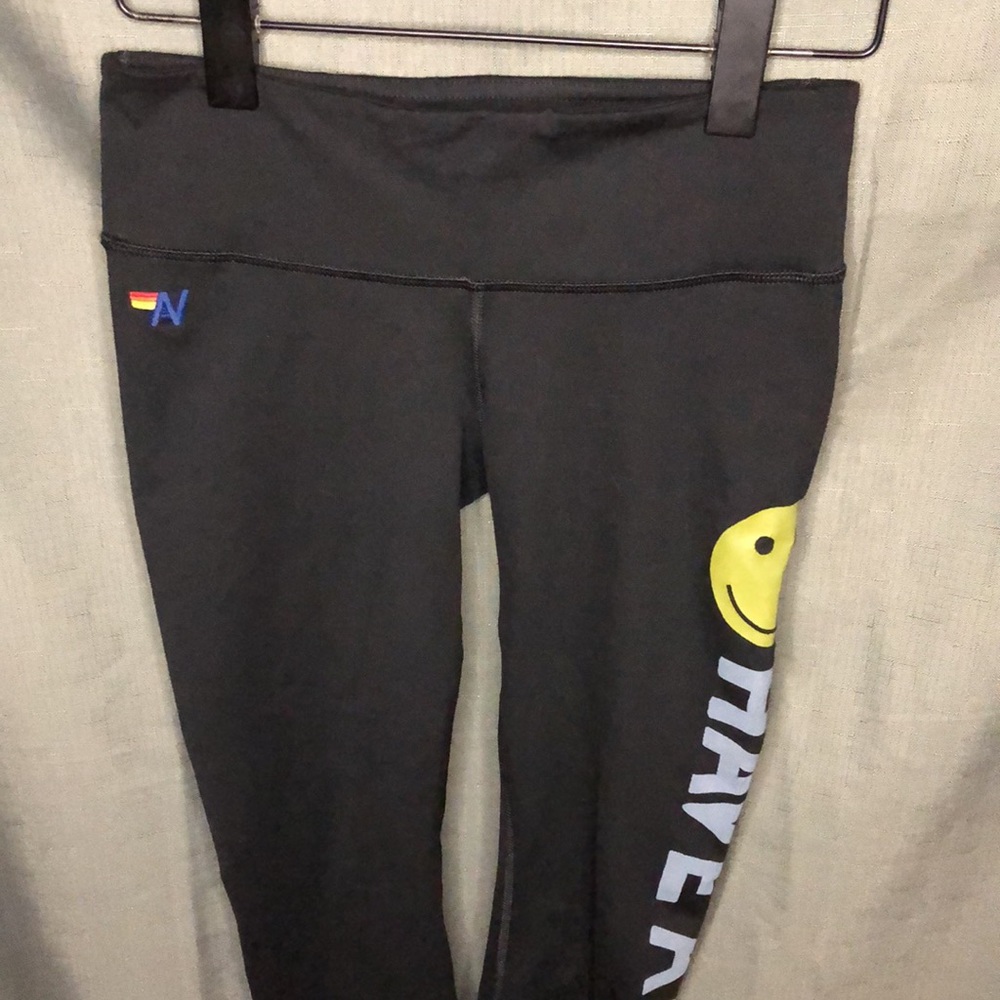 Aviator Nation Black Leggings with Yellow Smiley and White/Yellow Side Script - Picture 3 of 8